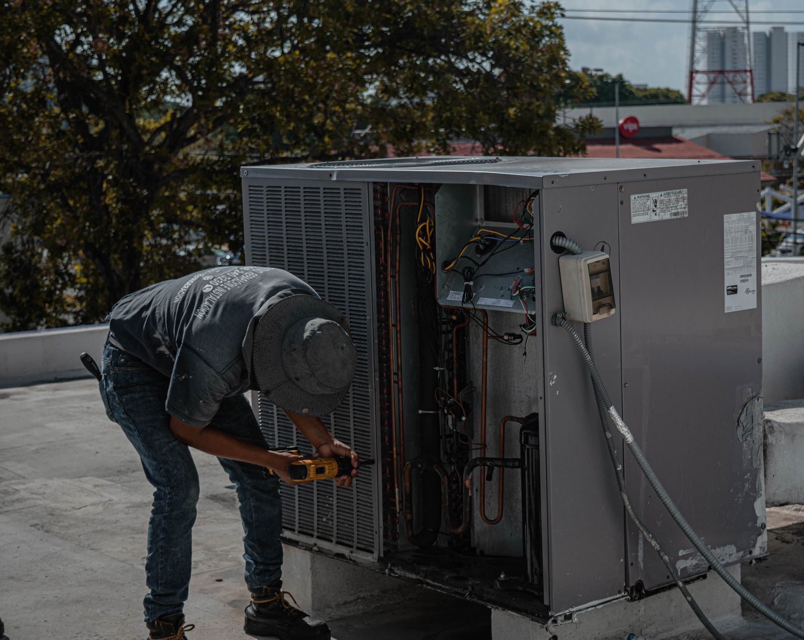 HVAC technician performing maintenance